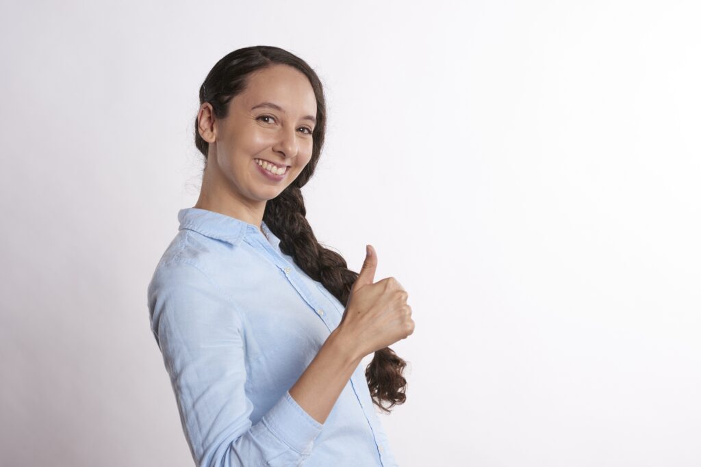 Smiling candidate giving a thumbs up after a successful legal jobs interview